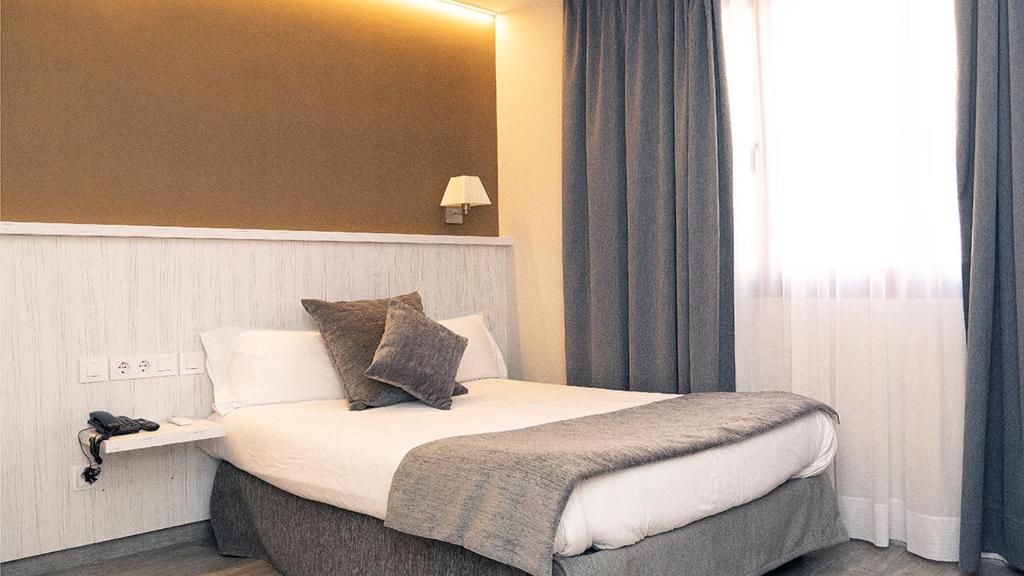 Postel nebo postele na pokoji v ubytování Hotel Coronado