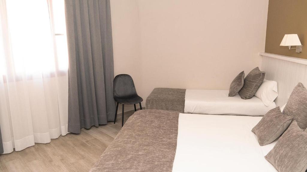 Postel nebo postele na pokoji v ubytování Hotel Coronado