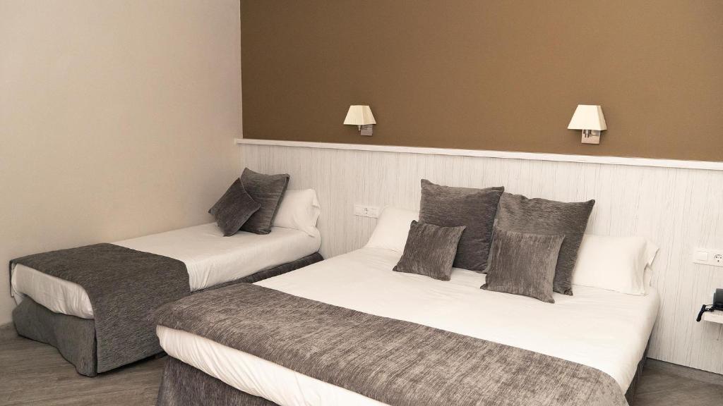 Postel nebo postele na pokoji v ubytování Hotel Coronado