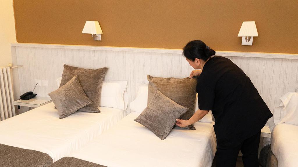 Postel nebo postele na pokoji v ubytování Hotel Coronado