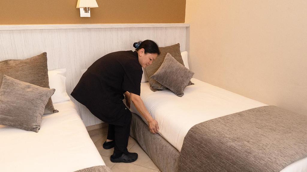 Postel nebo postele na pokoji v ubytování Hotel Coronado