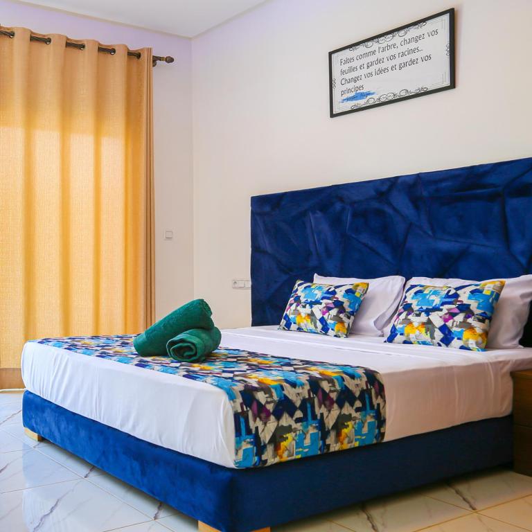 Postel nebo postele na pokoji v ubytování Hotel Jnane riad