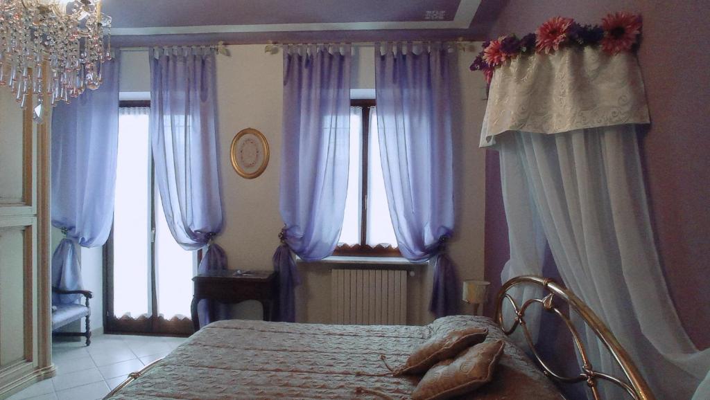 Posteľ alebo postele v izbe v ubytovaní LA CASA DEI MASUE'