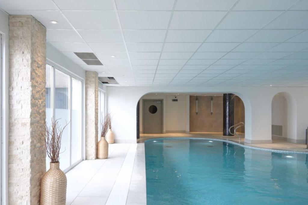 a large swimming pool in a building at The Angus Hotel & Spa in Blairgowrie