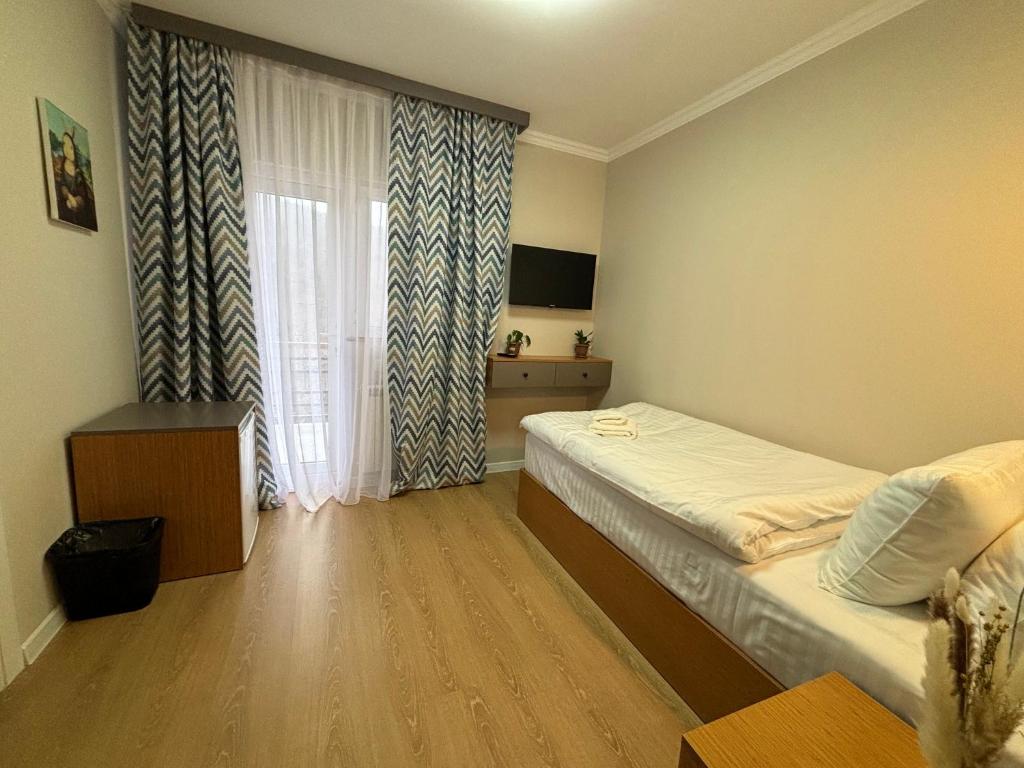 Postel nebo postele na pokoji v ubytování RestArt Boutique Hotel