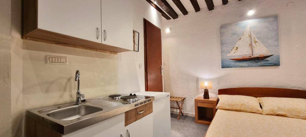 Kuchyň nebo kuchyňský kout v ubytování RD Apartments Center Zadar