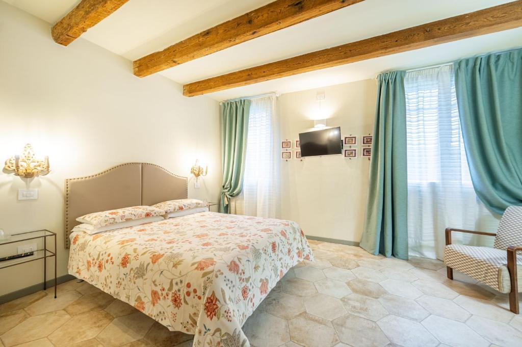 Postel nebo postele na pokoji v ubytování Soave Country House