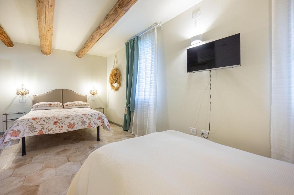 Postel nebo postele na pokoji v ubytování Soave Country House
