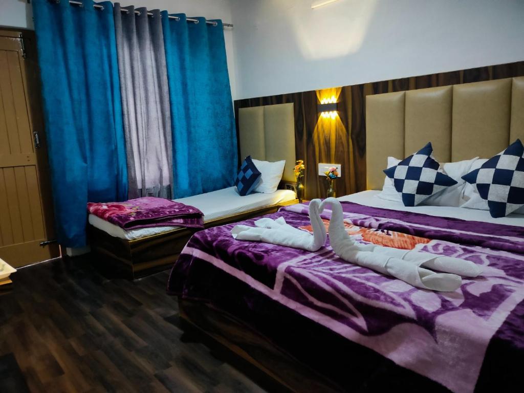 Lova arba lovos apgyvendinimo įstaigoje Hotel Durga Mall Road Manali