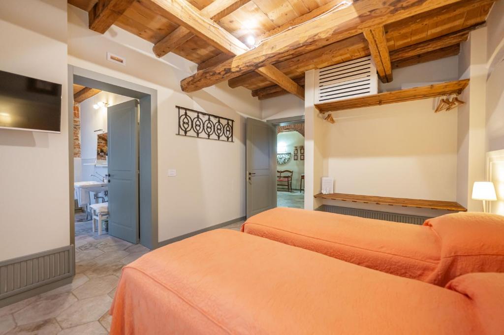 Postel nebo postele na pokoji v ubytování Soave Country House