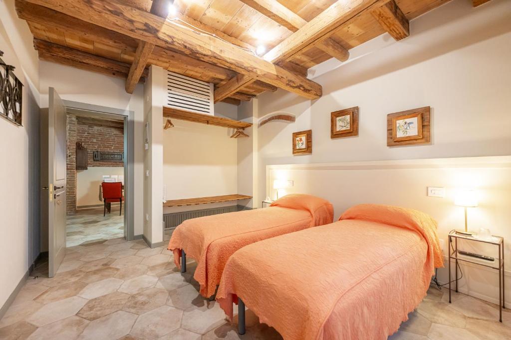 Postel nebo postele na pokoji v ubytování Soave Country House