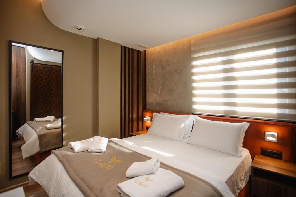 Postel nebo postele na pokoji v ubytování Hotel Flaer