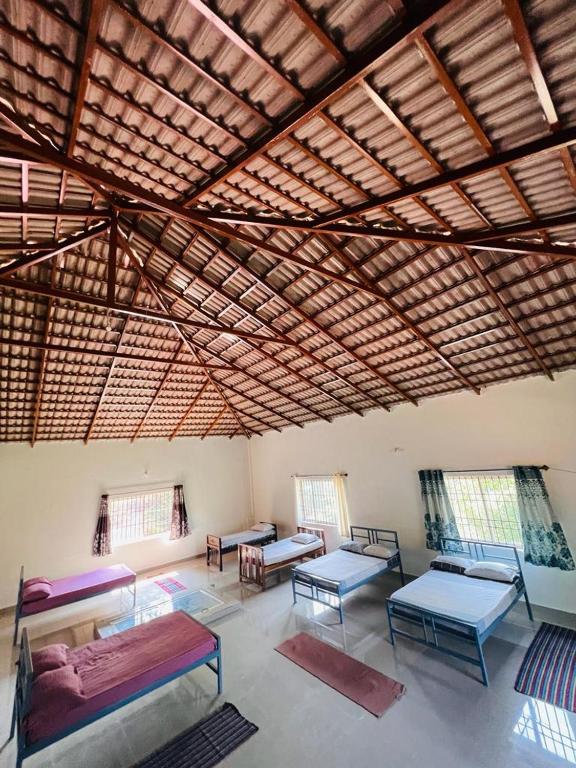 Postel nebo postele na pokoji v ubytování Prakruti Home stay