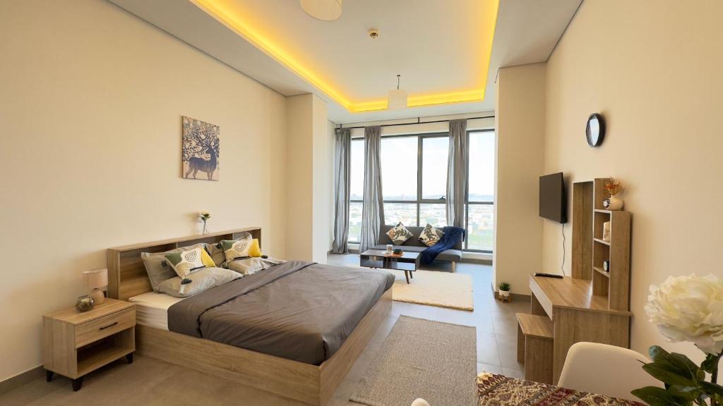 a bedroom with a bed and a tv in a room at Private Studio Burj Khalifa Area -BEST PRICE in Dubai