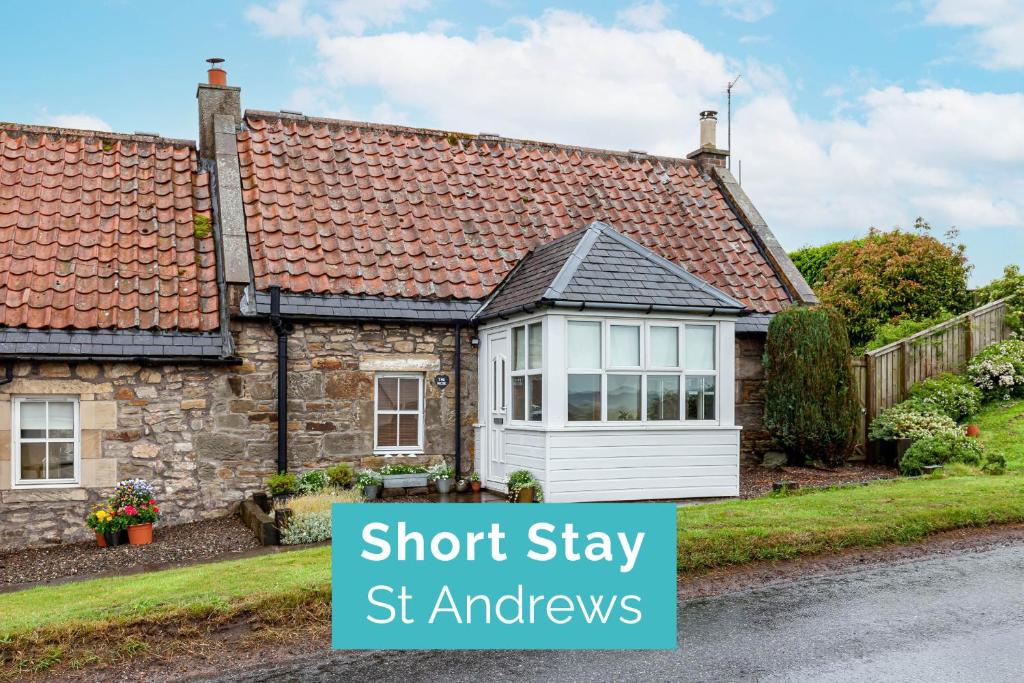 a cottage with a roof stay st andrews at The Neuk 4 miles to St Andrews in Strathkinness