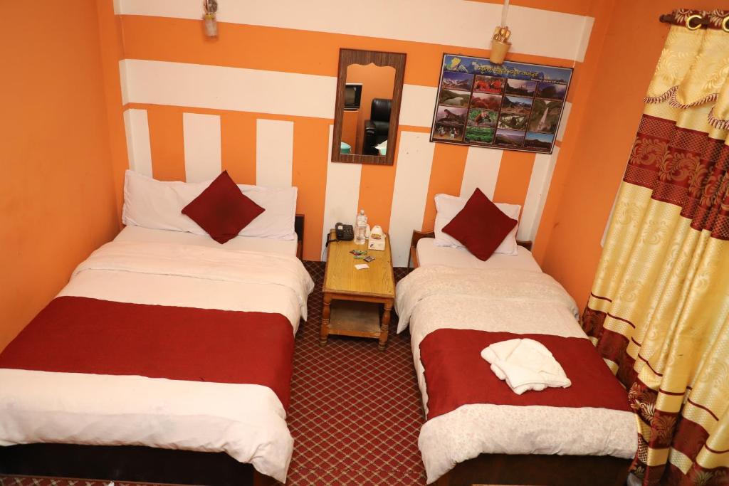 Krevet ili kreveti u jedinici u objektu Hotel Pathibhara