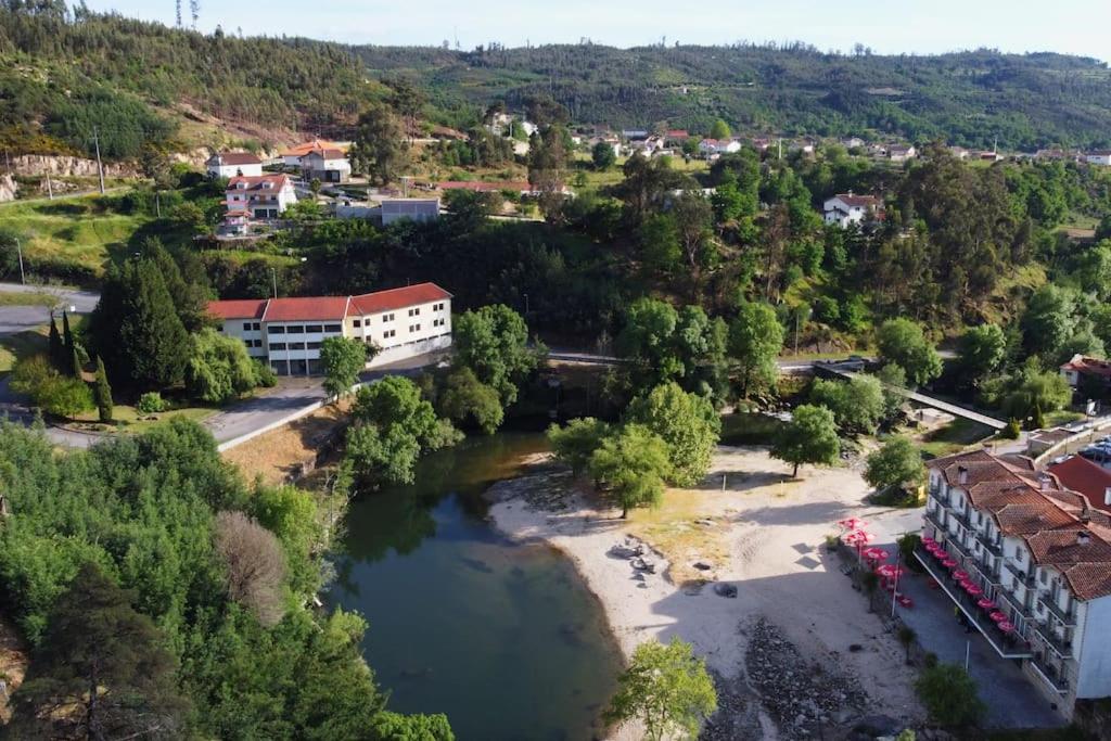 an aerial view of a town with a river at Vivenda Costa in Tondela