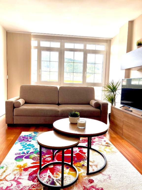 a living room with a couch and a table at Piso Vistas O Son in Cee