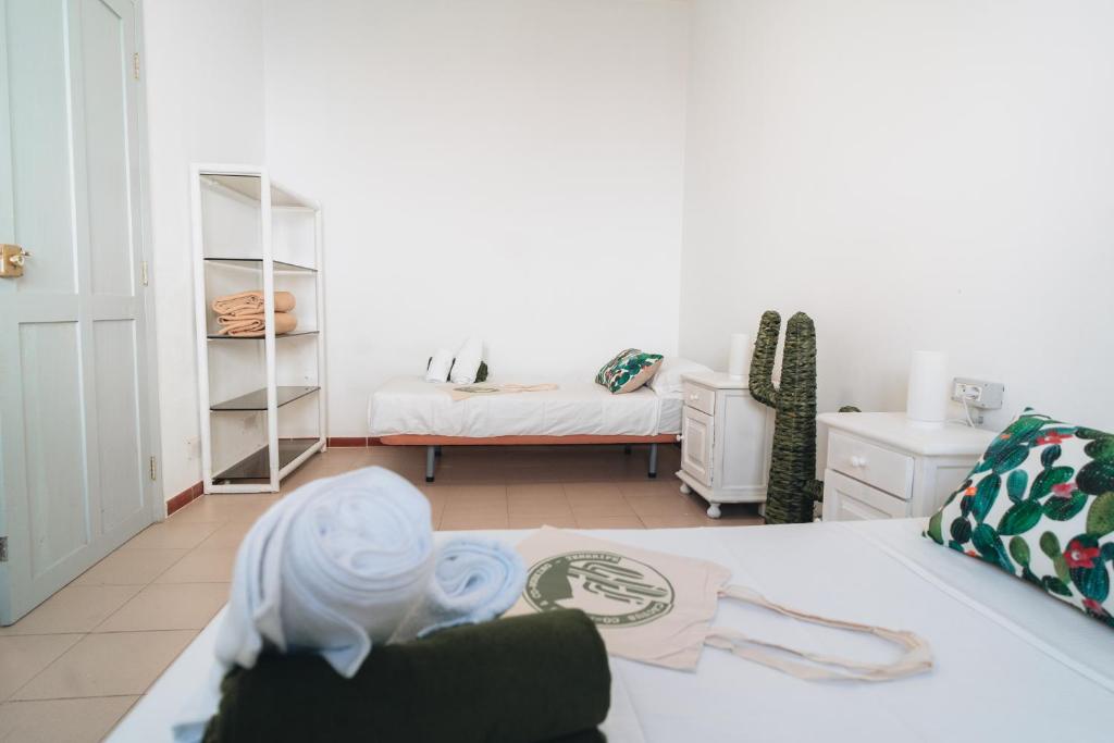 Postel nebo postele na pokoji v ubytování Hostal Colón