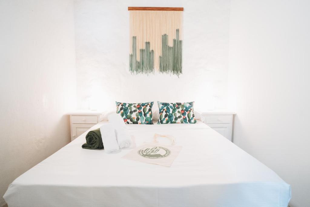 Postel nebo postele na pokoji v ubytování Hostal Colón