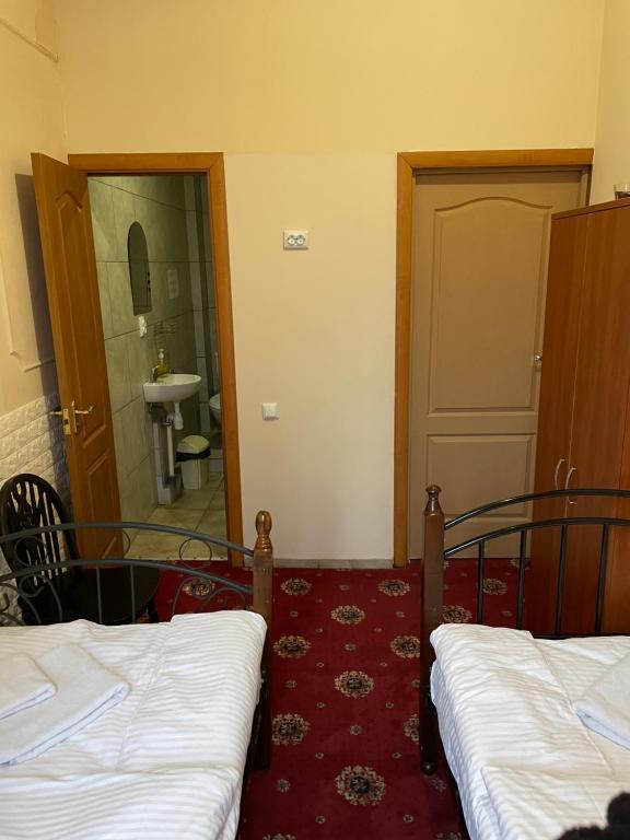 Postel nebo postele na pokoji v ubytování Mini Hotel Central Park
