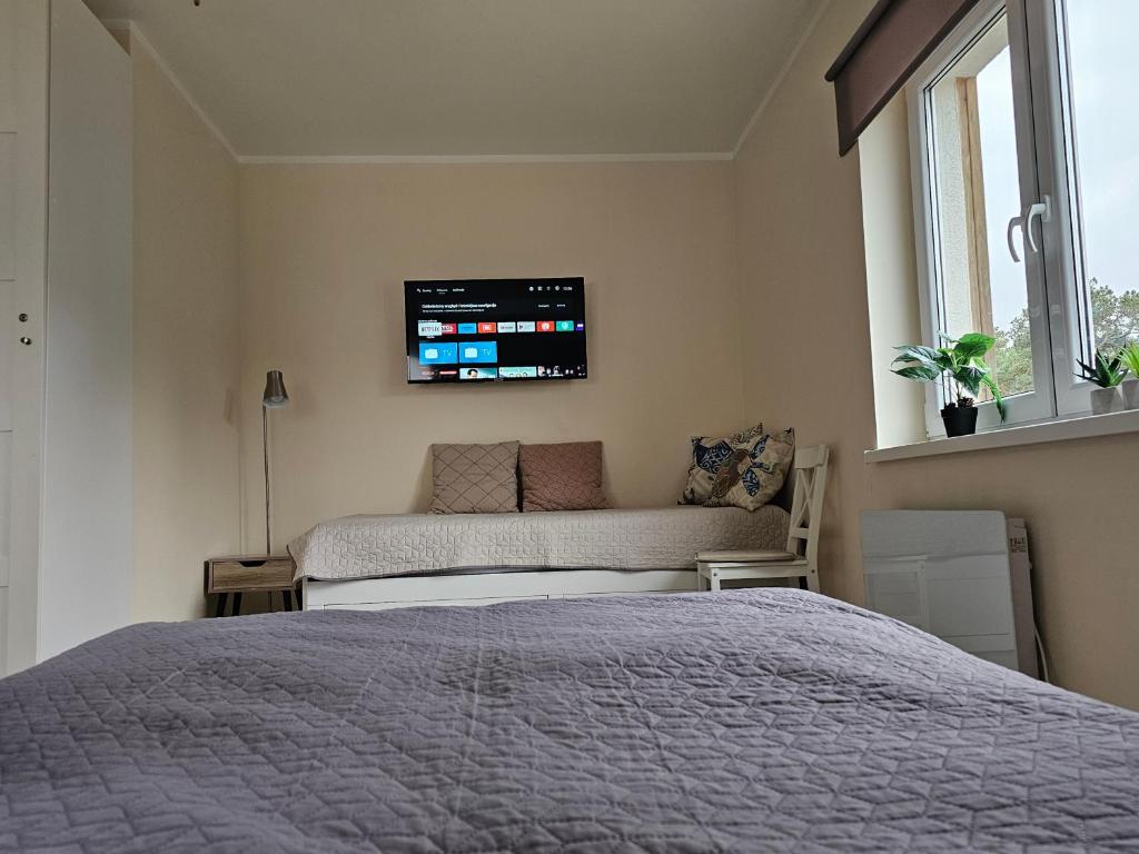 Posteľ alebo postele v izbe v ubytovaní Apartament Bałtyk
