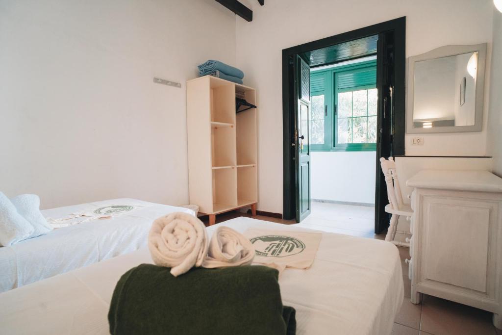 Postel nebo postele na pokoji v ubytování Hostal Colón