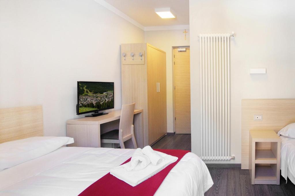 Postel nebo postele na pokoji v ubytování Hotel Croda Rossa