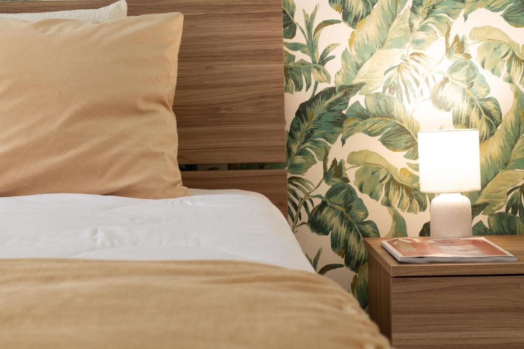 Postel nebo postele na pokoji v ubytování Sky Suite Green Pomezia
