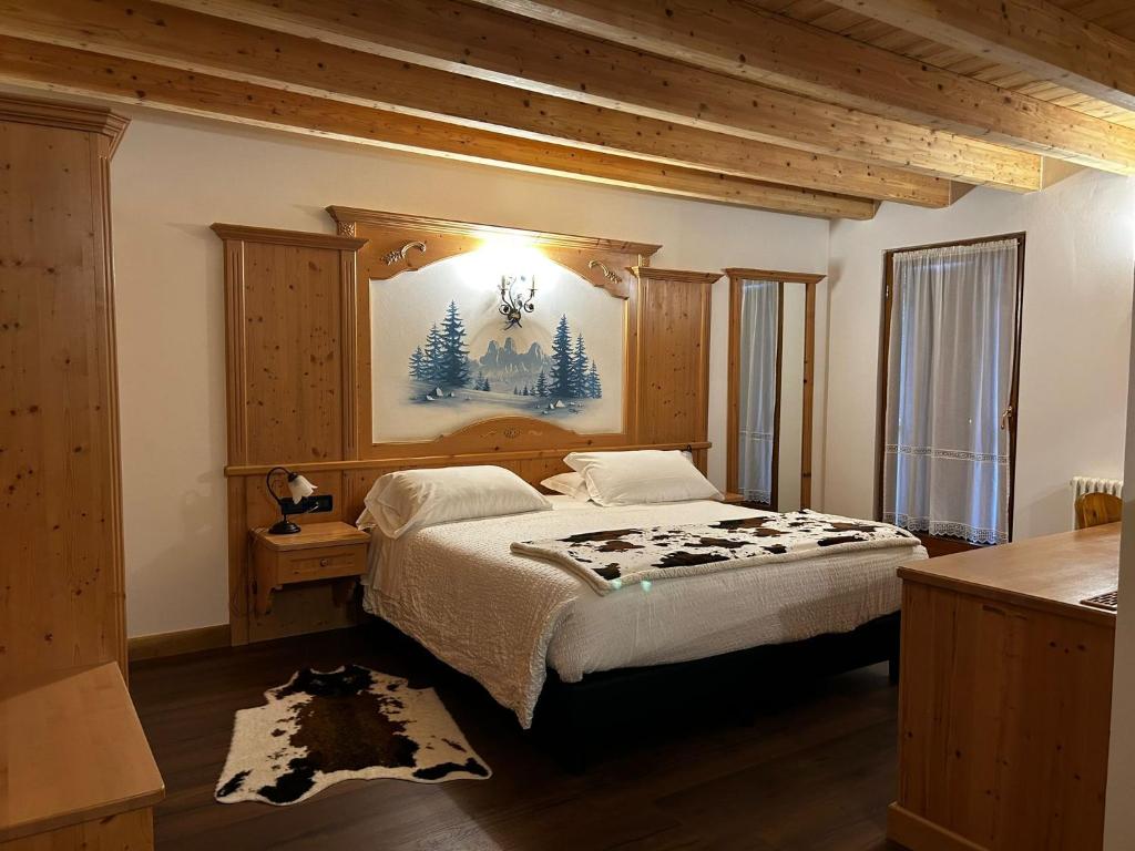 Postel nebo postele na pokoji v ubytování Hotel El Mondin