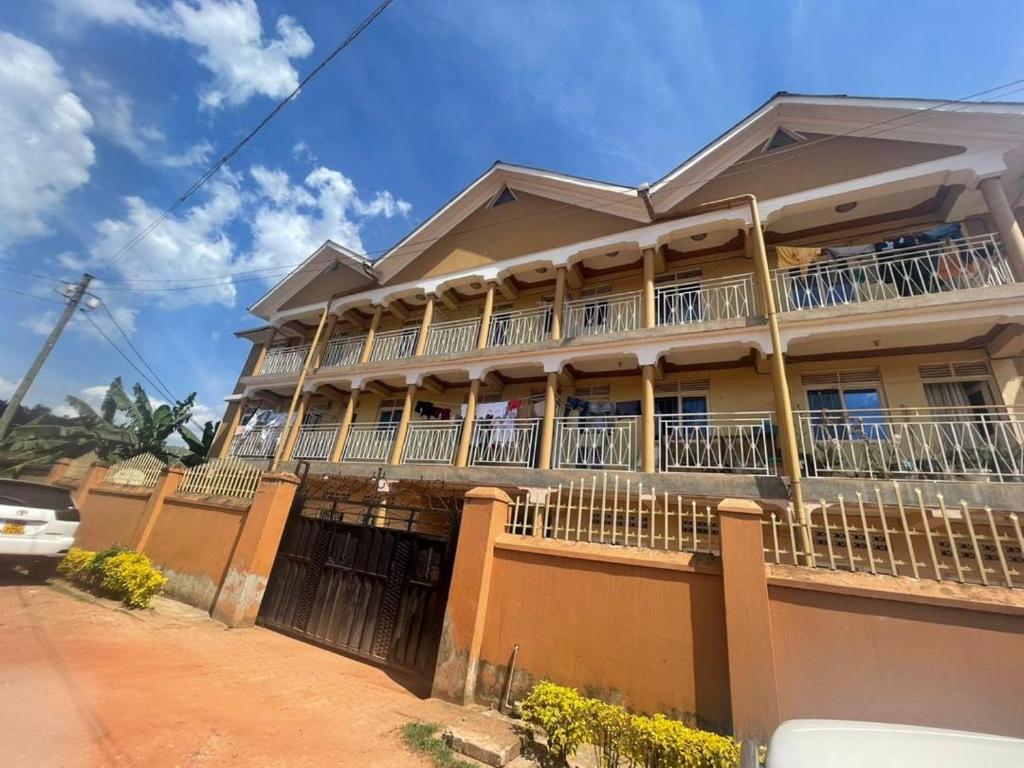 a large house with balconies on a street at Kabale town flat (sitting and bedroom) in Kabale