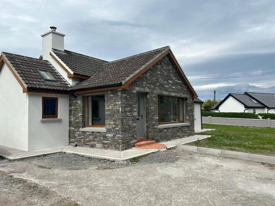 a small brick house with aphalt at Kerry Wish Cottage - Valentia Island in Knights Town