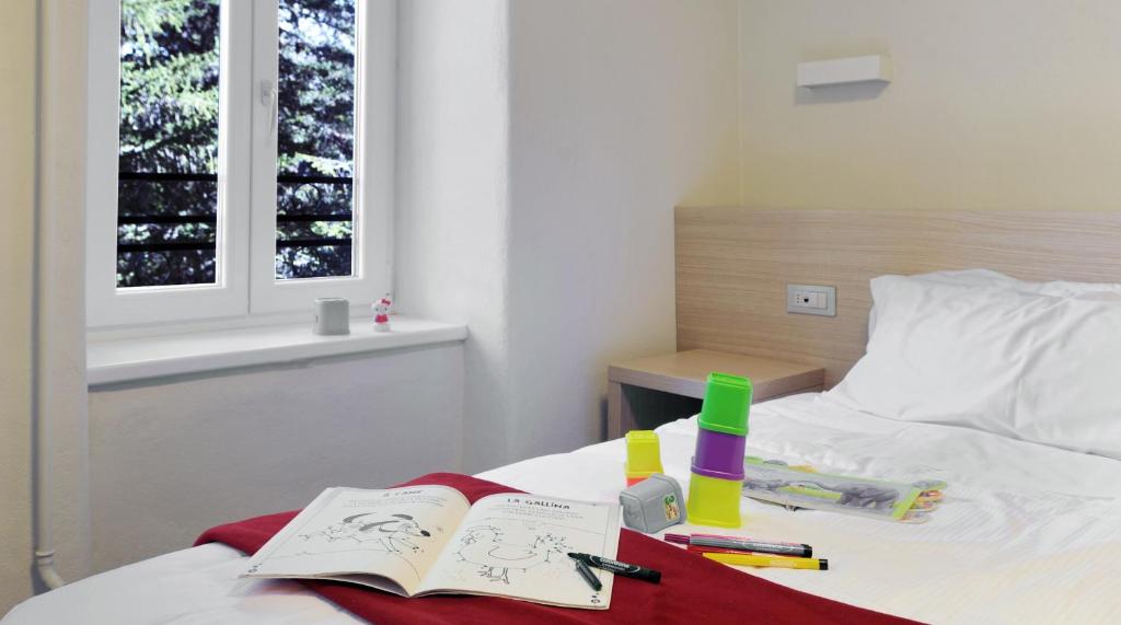 Postel nebo postele na pokoji v ubytování Hotel Croda Rossa