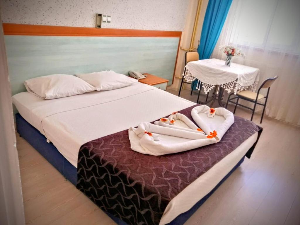 Postel nebo postele na pokoji v ubytování Uyum Hotel