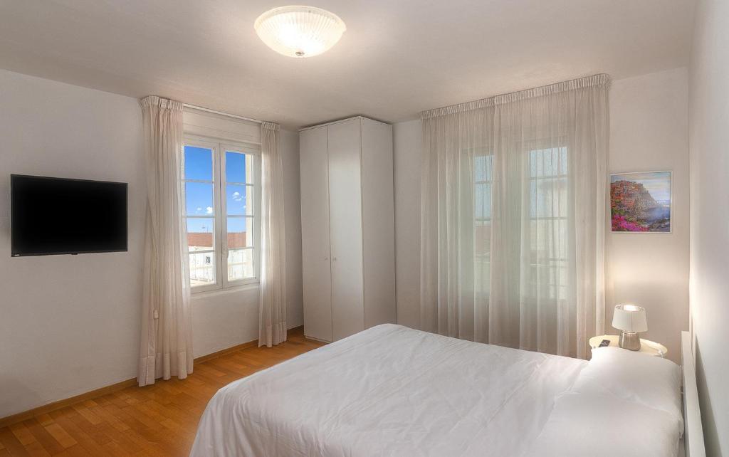 Ένα ή περισσότερα κρεβάτια σε δωμάτιο στο AMAMARE Apartments