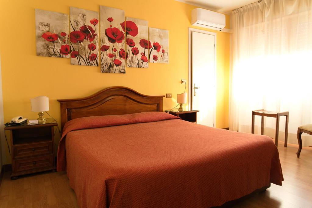 Postel nebo postele na pokoji v ubytování Albergo San Lorenzo