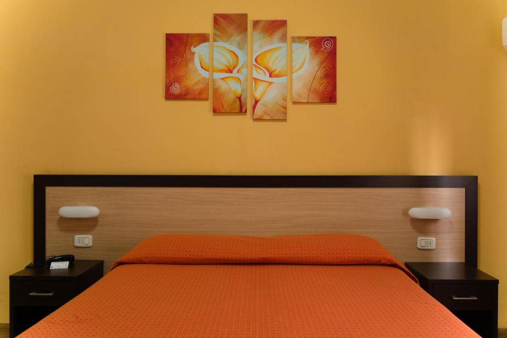 Postel nebo postele na pokoji v ubytování Albergo San Lorenzo