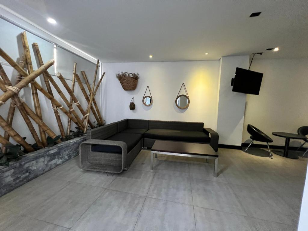 TV a/nebo společenská místnost v ubytování Hotel 47 Medellin Center