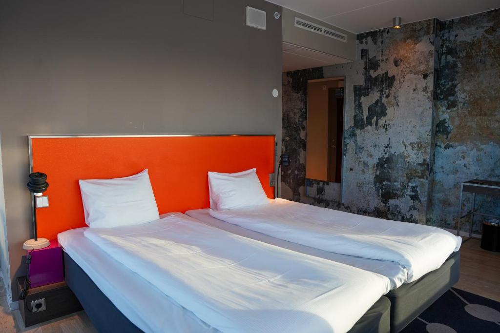 Postel nebo postele na pokoji v ubytování Comfort Hotel Winn