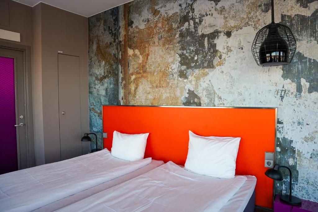 Postel nebo postele na pokoji v ubytování Comfort Hotel Winn