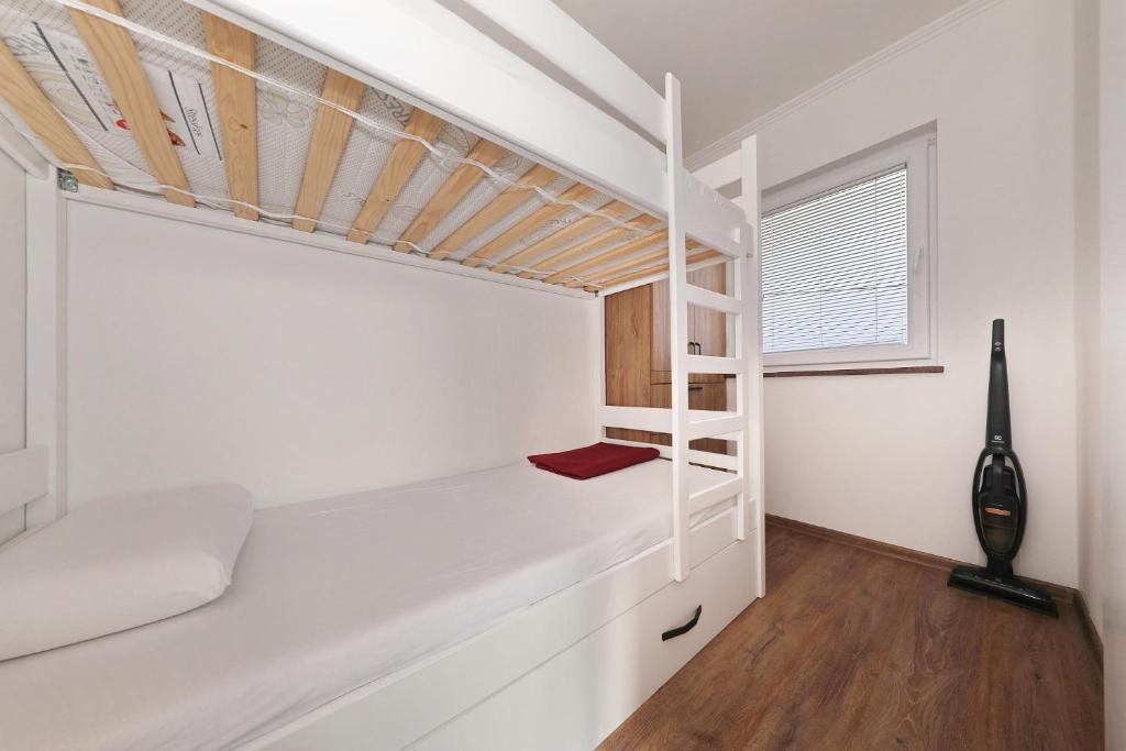 Postel nebo postele na pokoji v ubytování Apartman Sipina 1