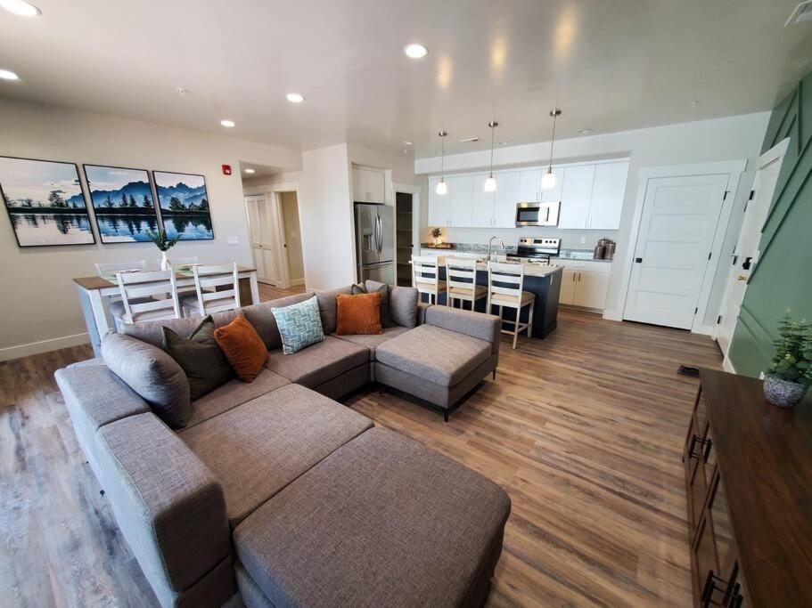 a large living room with a couch and a kitchen at Monroe Mountain Suite - Castle Rock Condos in Richfield