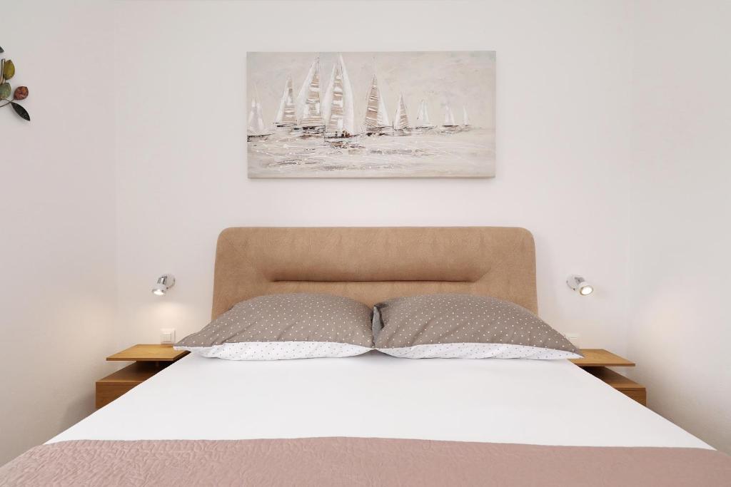 Posteľ alebo postele v izbe v ubytovaní Apartman Sipina 2