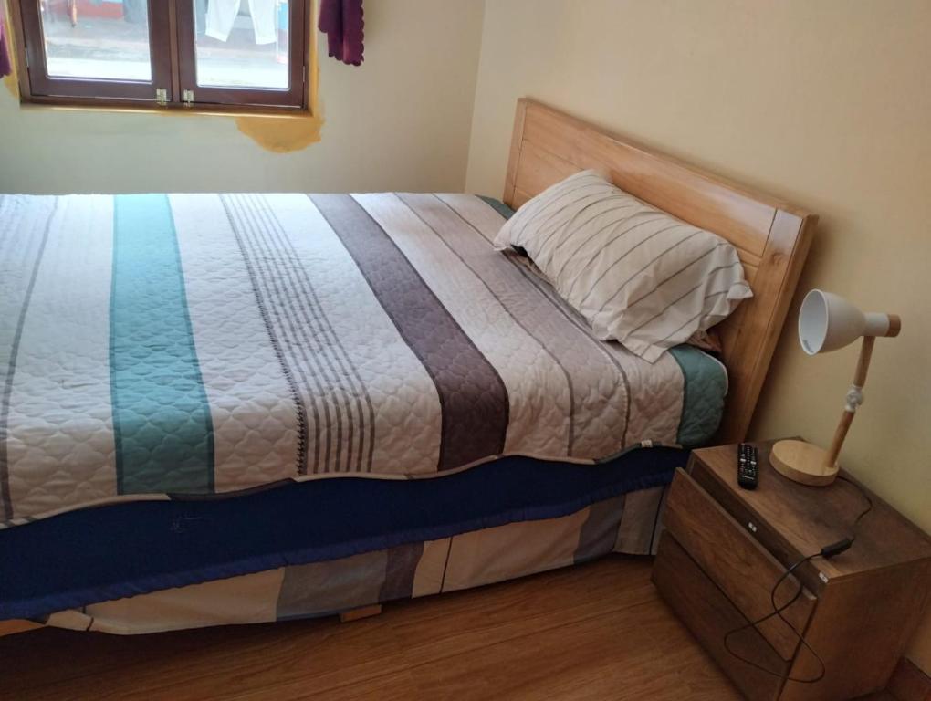 Кровать или кровати в номере Casa Abuelito's Andean Haven