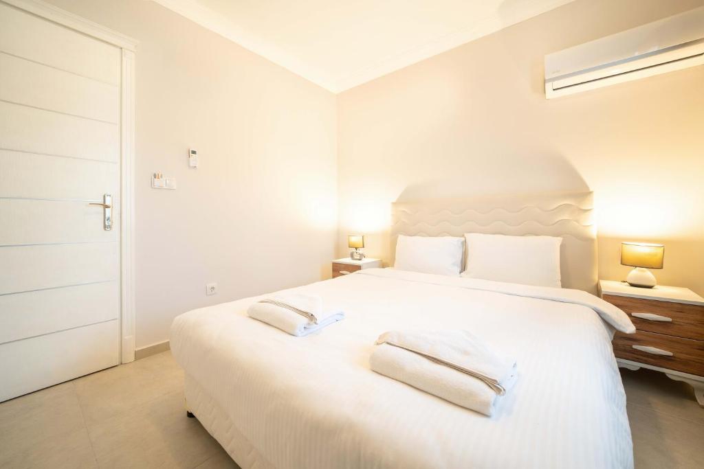 Postel nebo postele na pokoji v ubytování Dedeminn Garden Hotel