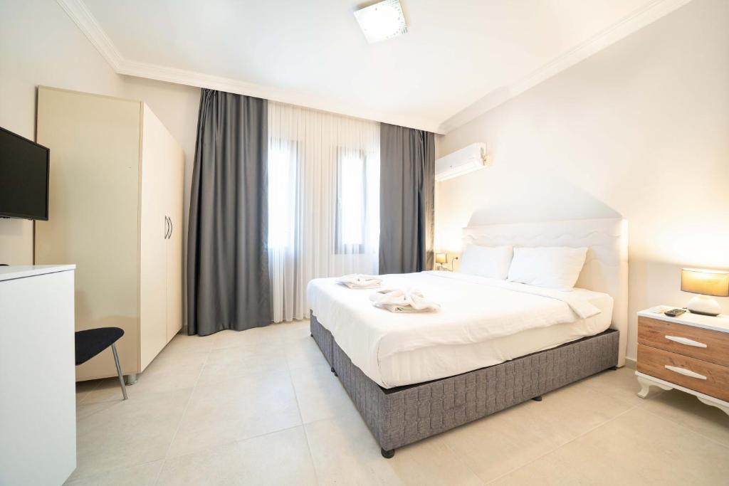 Postel nebo postele na pokoji v ubytování Dedeminn Garden Hotel