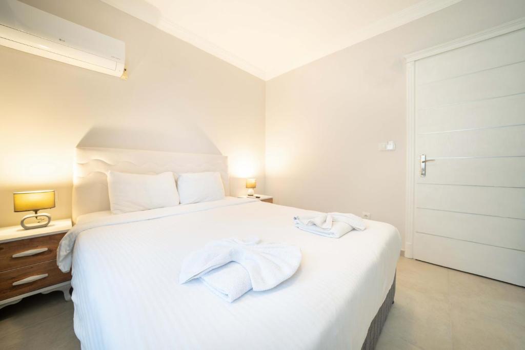 Postel nebo postele na pokoji v ubytování Dedeminn Garden Hotel