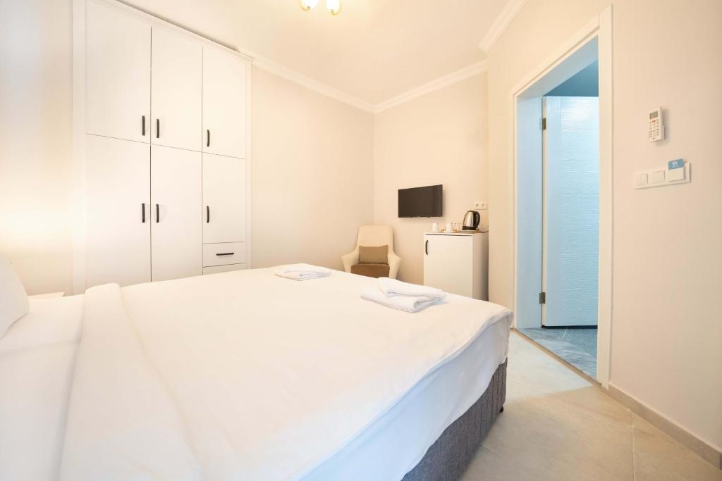 Postel nebo postele na pokoji v ubytování Dedeminn Garden Hotel