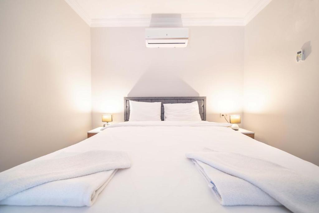 Postel nebo postele na pokoji v ubytování Dedeminn Garden Hotel