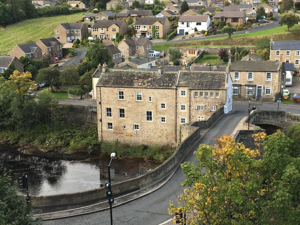 a city with a bridge over a river and a town at Grade II listed house with river and castle views - Barnard Castle in Barnard Castle